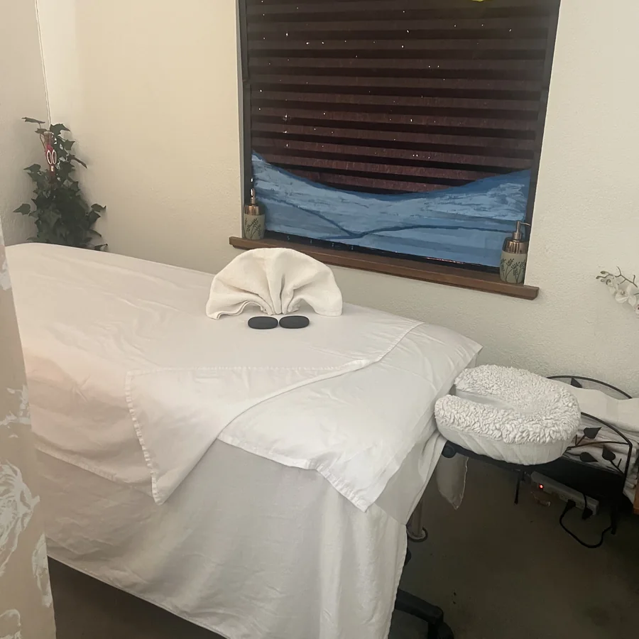 The treatment room at Natural Essence Massage, table made up